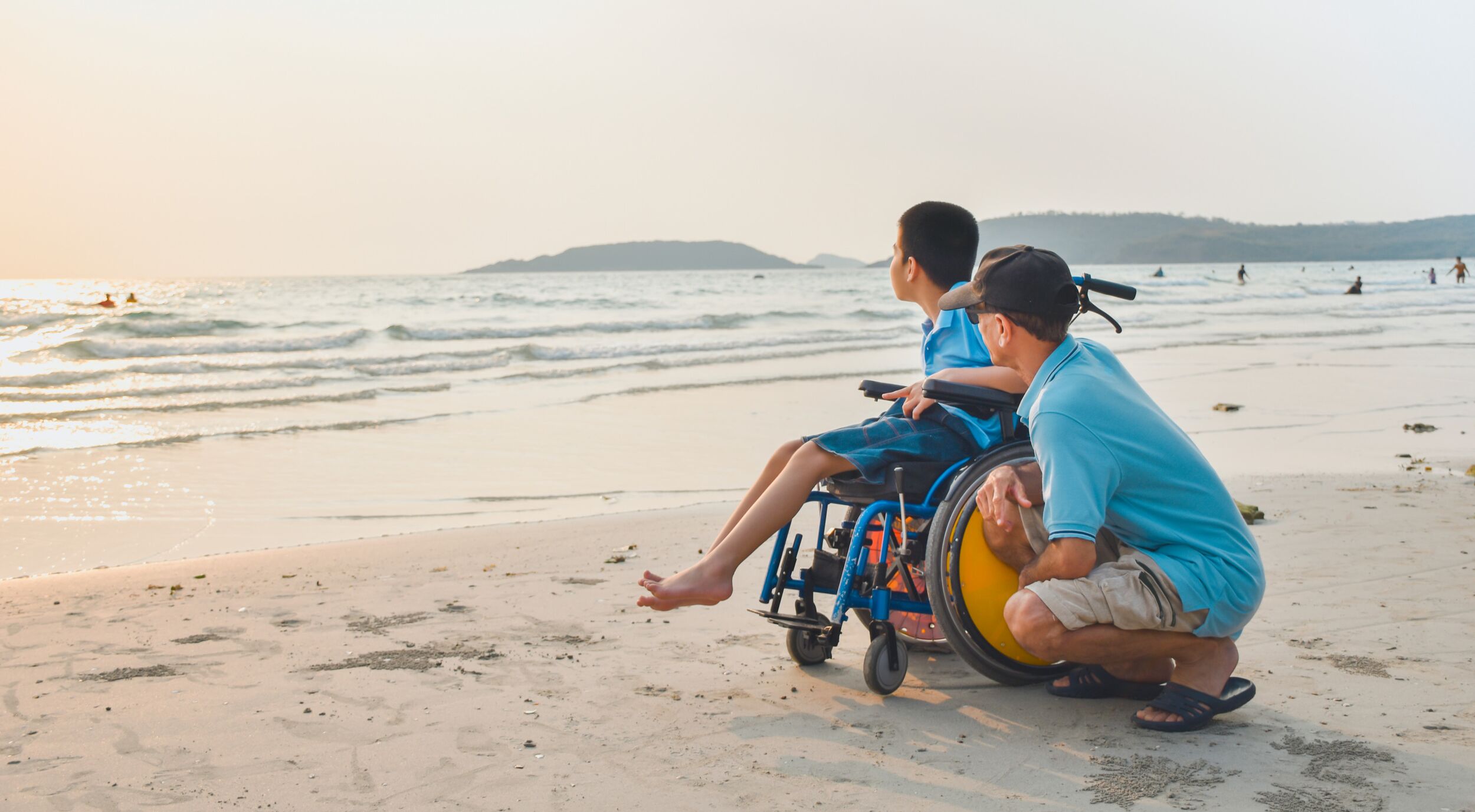 Man and boy at a beach.